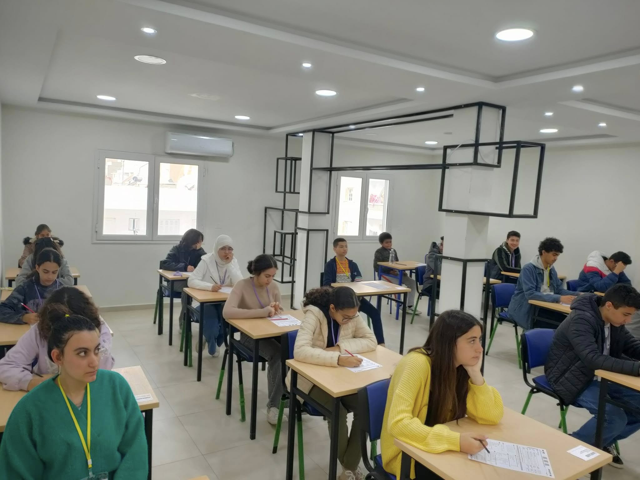 Students taking a Cambridge English exam in the classroom