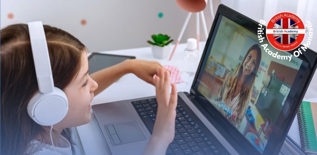 Child taking a live online English class from home on a laptop