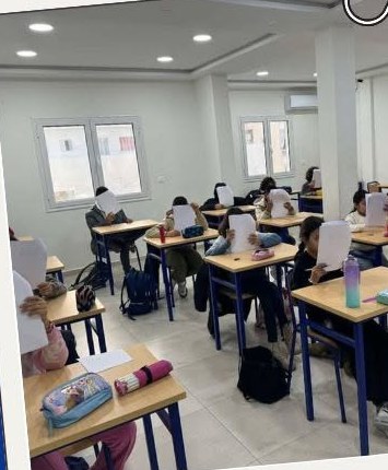 Primary school pupils working at their desks during a support class